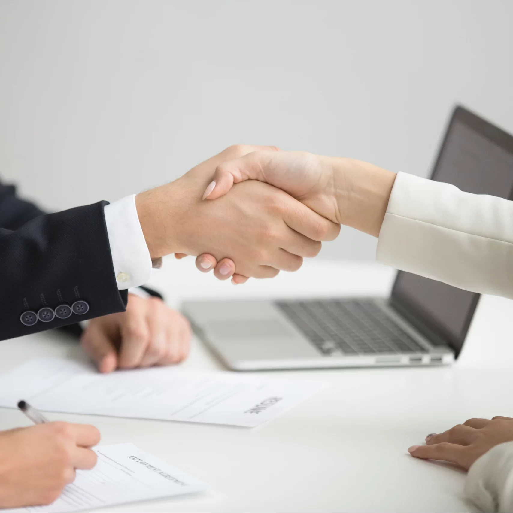 hr-handshaking-successful-candidate-getting-hired-new-job-closeup (1)