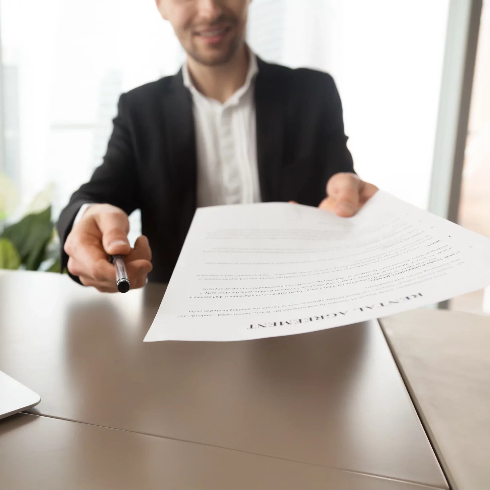 real-estate-agent-offers-sign-rental-agreement (1)